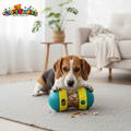 Watermarked dog playing with treat toy